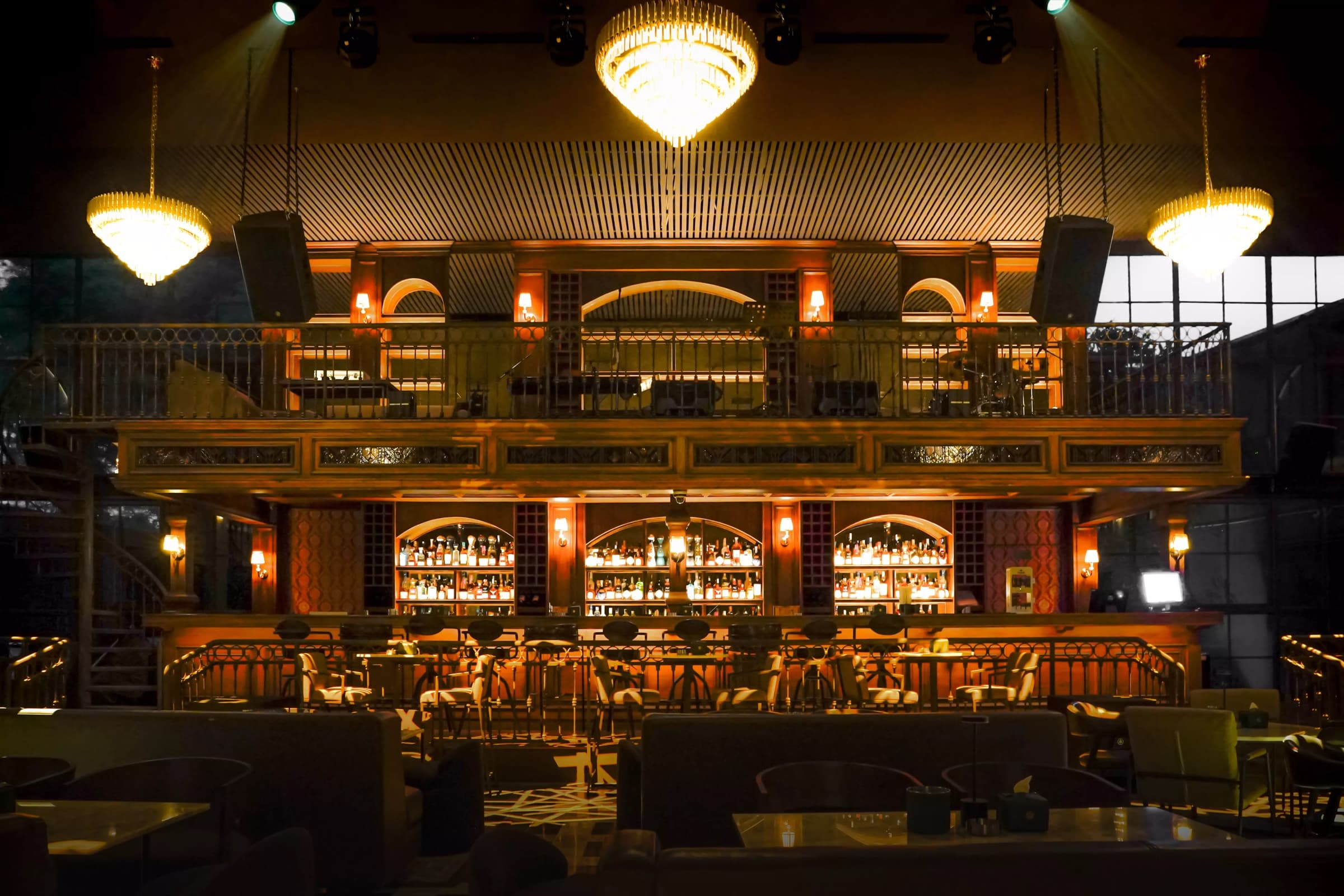 Cecilia at Holywings Group, showing the venue's main bar and performance stage